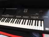 a keyboard that is sitting on top of a suitcase