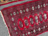two rugs on the ground next to each other