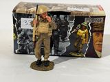 figurine of a soldier with a rifle in front of a box