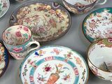 many different types of china plates and bowls on the table