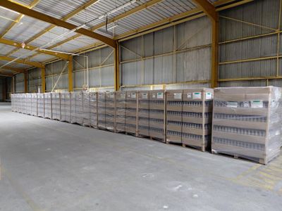 a large warehouse filled with lots of boxes and pallets