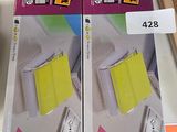 two boxes of post - it notes on the table