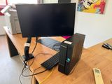 a desktop computer sitting on top of a wooden desk