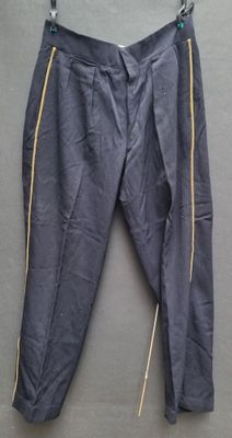 grey pants with yellow zippers hanging on a hanger