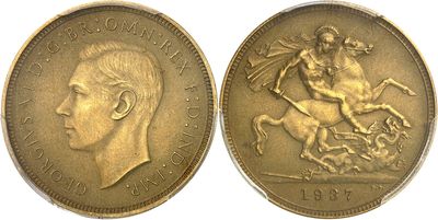 a close up of two gold coins with a man on a horse