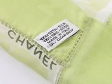 the label is on a green shirt with white writing on it