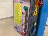 an image of a machine that is in a garage