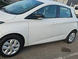 a picture of a white car parked in a parking lot