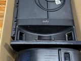a cardboard box with a television in it sitting on a table