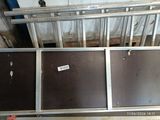 a metal bed frame with a sign on it in a room