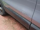 a close up of a car ' s door handle and the door handle of the car