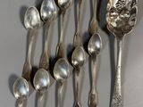 several spoons and spoon spoons are lined up on a table
