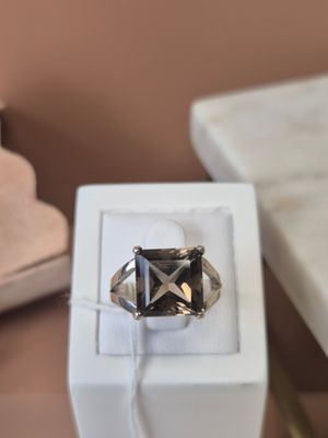 a ring that is sitting in a box on a table