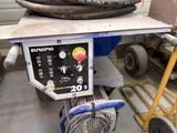 a cart with a bunch of hoses on top of it
