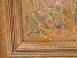 a picture of a painting of flowers in a gold frame