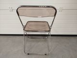 a chair that is sitting in front of a garage door