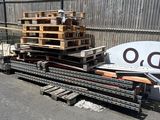 a pile of pallets sitting on the side of the road