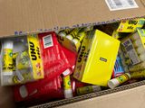 a cardboard box filled with assorted items in it