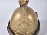 an old brass bell with a dog on top of it