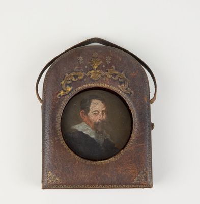 portrait of a man with a beard in a leather case