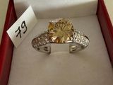 a diamond ring in a red box with a price tag on it