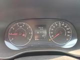 a close up of a car dashboard with a speedometer and gauges