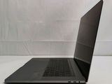 a laptop that is sitting on a white table