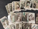 a lot of old postcards on the table