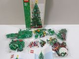 a box of lego christmas tree decorations on a table