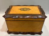 an image of a wooden box with a decorative design on it