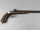 an old gun that is sitting on top of a table