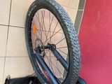 a bicycle that is leaning up against a wall