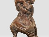 an image of a bronze statue of a man and a woman