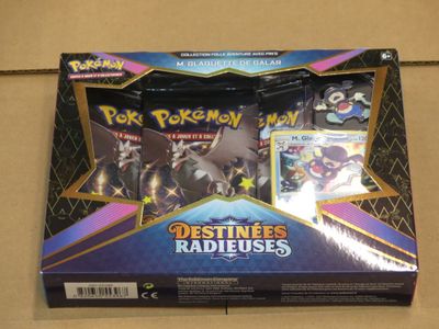 the box of the pokemon trading card game is open and ready to be played