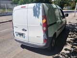 a white van that is parked on the side of the road