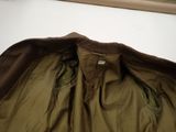 an image of a brown jacket is sitting on a white surface