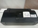 a black printer sitting on top of a white table
