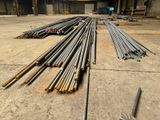 a lot of steel rods that are laying out on the ground