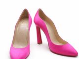 a pair of pink high heels on a white background