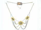 a necklace with a gold chain and a gold eye on it