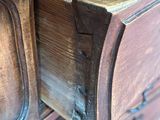 a close up of a wooden drawer with a drawer in it