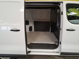 a white van with its doors open in a parking lot