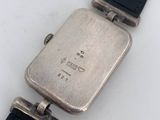 a close up of a wrist watch with a black strap