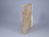 an old book that is sitting on a table