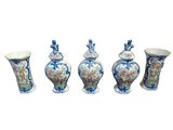 three vases are sitting next to each other on a white surface