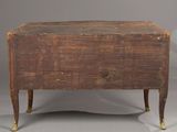 an old wooden chest sitting on top of a gray floor