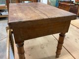 a wooden table that is sitting on top of a wooden table
