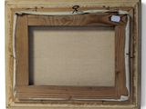 an old picture frame with a piece of wood sticking out of it
