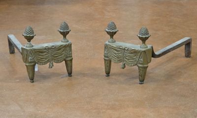 two statues that are sitting on a bench