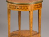 an image of a small round table with a wooden top